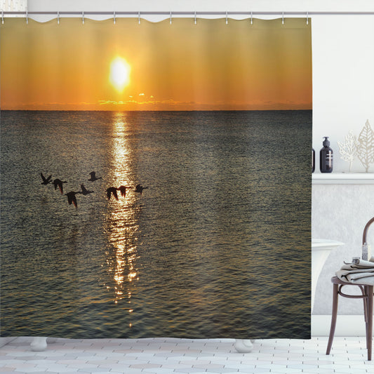 Birds of orange and grey soaring over a tranquil lake: A unique shower curtain design.